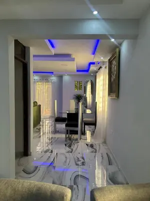 a living room with blue lights on the ceilings at Apartamento Oasis in La Caleta