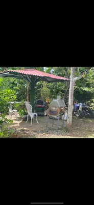 a tent and a table and a chair under a canopy at La paz y tranquilidad