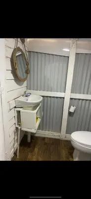 a bathroom with a sink and a toilet at La paz y tranquilidad