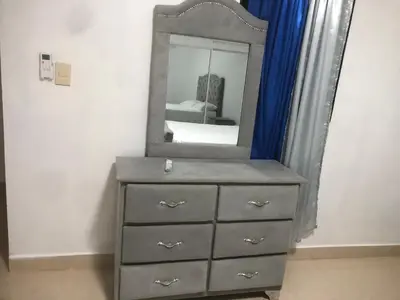 a dresser with a mirror on top of it at Apartamento de lujo amueblado Guadeca B in Juan López