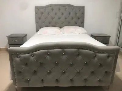 a bed in a bedroom with two night stands at Apartamento de lujo amueblado Guadeca B in Juan López