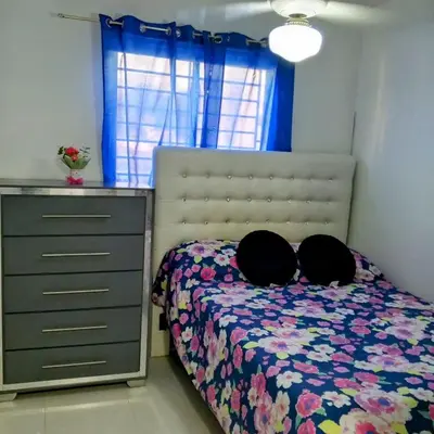 a bedroom with a bed with a dresser at Prados de la Montana in Bartola