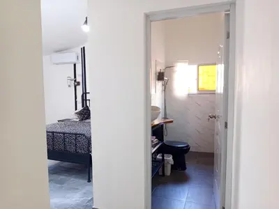 a small room with a bed and a bathroom at Italiana Hogares in Boca Chica