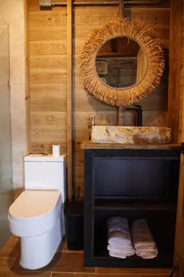 a bathroom with a white toilet and a mirror at Casa Loma, Descansar en la Montaña, 30min STG in La Búcara