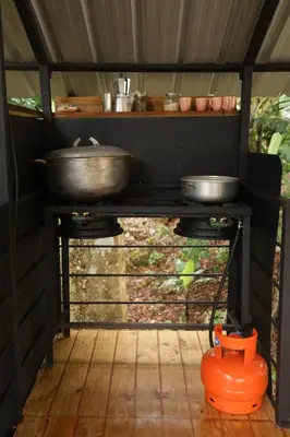 a stove with pots and pans on top of it at Casa Loma, Descansar en la Montaña, 30min STG in La Búcara