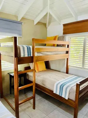 a bedroom with two bunk beds in a room at Sole E Mare Beach House in Las Terrenas