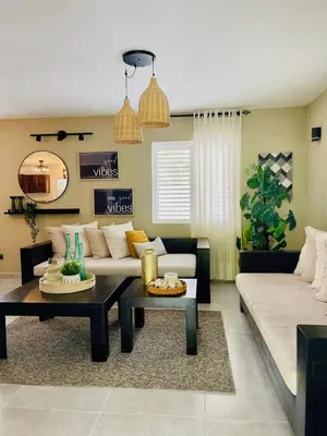 a living room with a couch and a table at Sole E Mare Beach House in Las Terrenas