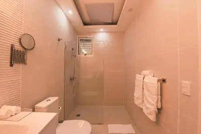 a bathroom with a shower and a toilet at Penthouse with jacuzzi in Lake View in Las Terrenas