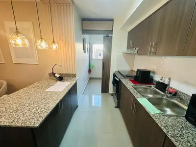 a kitchen with a sink and a counter top at Urban oasis,3 beds, Elevator, Near the airport in Juan López