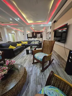a living room with a couch and a tv at Home away from home in Guayacanes