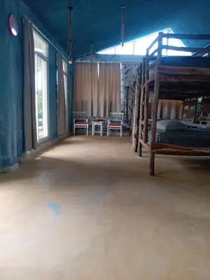 an empty room with two bunk beds and windows at Home away from home in Guayacanes