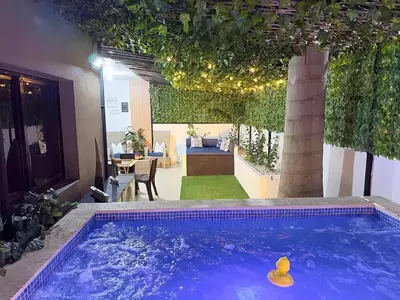a swimming pool in the middle of a house at Luxury Apartment-Santiago- PRIVATE Jacuzzi & Patio-Near Airport in Santiago de los Caballeros