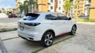 a white car parked on the side of a street at Luxury Apartment-Santiago- PRIVATE Jacuzzi & Patio-Near Airport in Santiago de los Caballeros