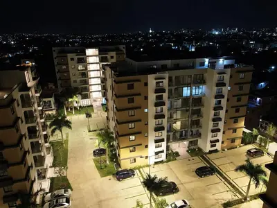 an aerial view of a parking lot in front of a building at Luxury Apartment-PRIVATE Patio & BBQ-Near Airport in Santiago de los Caballeros