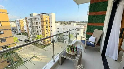 a balcony with a table and chairs on a balcony at Luxury Apartment-PRIVATE Patio & BBQ-Near Airport in Santiago de los Caballeros