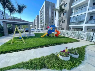 a park with a playground with a swing at Luxury Apartment- PRIVATE Patio & BBQ- Near Airport in Santiago de los Caballeros