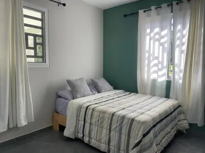 a bedroom with a bed and a window at Casa Finca El Encanto - 8 pax, A Minutos de la Playa in Arroyo El Cabo
