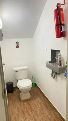 a bathroom with a toilet and a sink at Villa Langosta in Las Terrenas