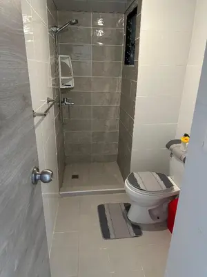 a bathroom with a shower and a toilet at Residencial habitat uno in Los Paredones