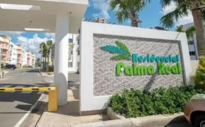 a sign for a flintquartered flintquartered building at Palma Real Apt Near Cibao Airport & Pool in Santiago de los Caballeros