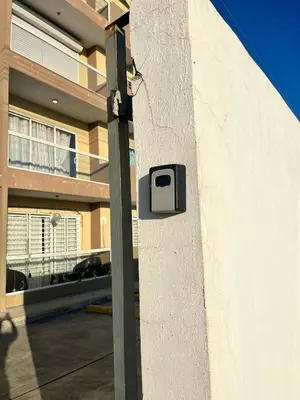 a box on the side of a wall in front of a building at Ocean View Apartment in Santo Domingo Este in La Viva