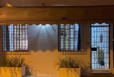 a house with three windows in front of it at SDQ Colonial Zone an great find in Santo Domingo