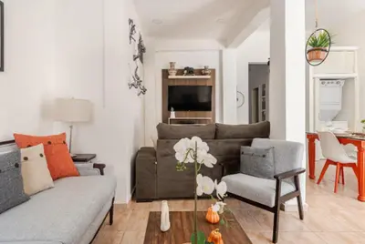 a living room with a couch and a table at SDQ Colonial Zone an great find in Santo Domingo