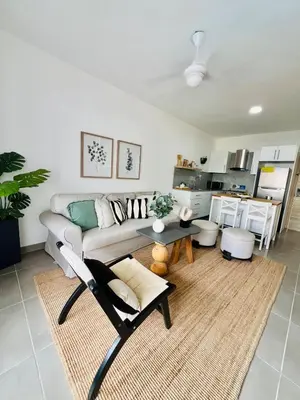 a living room with a couch and a table at Caribbean dream in Punta Cana in Colorado