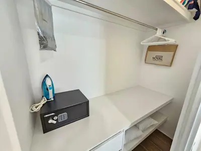 a white closet with a white shelf and aabinet at Cana Cove in Punta Cana