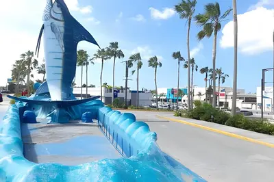 a blue water slide with a shark on it at Condominio privado con piscina, cerca de la playa in Punta Cana