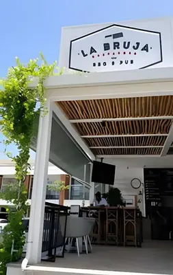 a restaurant with a sign on the front of it at Condominio privado con piscina, cerca de la playa in Punta Cana
