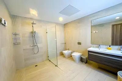 a bathroom with a shower and a sink and a toilet at Cana Pearl Fase I y II in Punta Cana