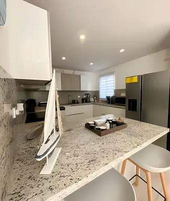 a kitchen with a counter with a boat on it at Cana Pearl Fase I y II in Punta Cana