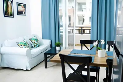 a living room with a couch and a table at Alojamientos de 1 y 2 habitaciones a 5 min de la playa in Punta Cana