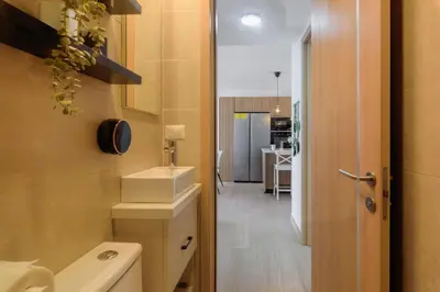 a small bathroom with a sink and a toilet at Escapada caribena: Piscina y cerca de la playa in Punta Cana