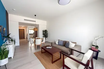 a living room with a couch and a table at Alojamientos en Coral Bay II Cerca del Hard Rock Hotel Punta Cana in Punta Cana