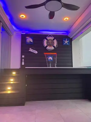 a bar with purple lights on a wall at Beachfront Three Bedroom apt with Jacuzzi in Juan Pedro