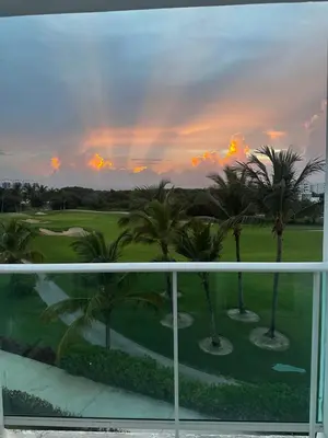 a view from the balcony of a resort with palm trees at PentHouse Jakuzzi Hotel Hard Rock in Punta Cana