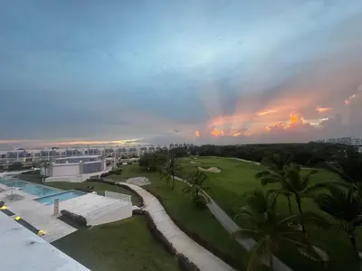 a view of a resort with a rainbow in the sky at PentHouse Jakuzzi Hotel Hard Rock in Punta Cana