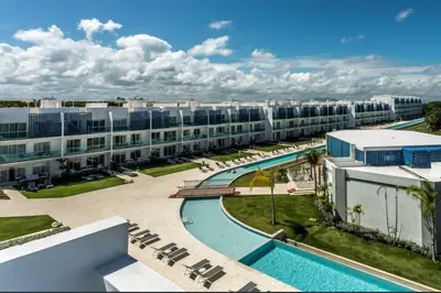 an apartment complex with a swimming pool and a resort at PentHouse Jakuzzi Hotel Hard Rock in Punta Cana