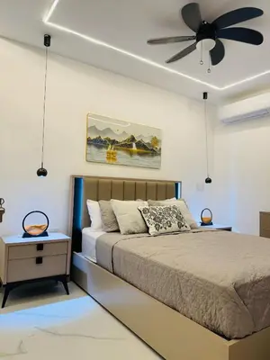 a bedroom with a bed and a ceiling fan at Residencial mar azul Bayahibe in Bayahibe