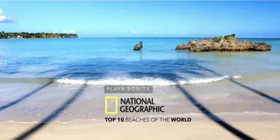 a picture of a beach with a rock in the water at ALL-NEW Modern and Stylish Apartment with Rooftop Infinity Pool in Las Terrenas