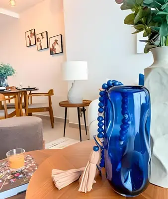 a blue vase sitting on top of a table at Gardenia B31 in Punta Cana