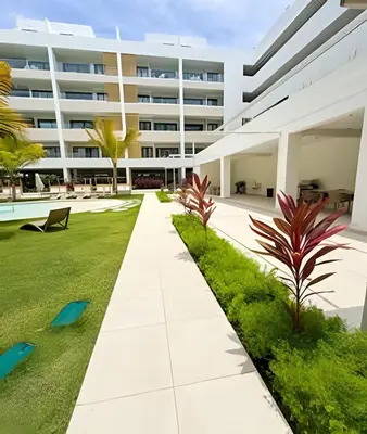 an external view of a building with a garden at Gardenia B31 in Punta Cana