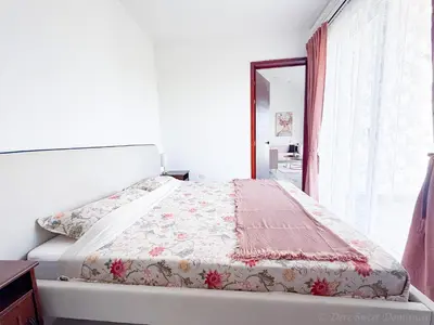 a bed in a room with a window at Elysium Suits Maximum Comfort in Punta Cana