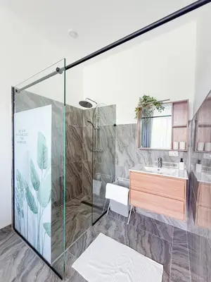 a bathroom with a shower and a sink at Elysium Suits Maximum Comfort in Punta Cana