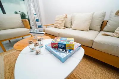 a living room with a coffee table with snacks on it at Cana Rock Star D208 Jaccuzi Pool Golf and Private Beach in Punta Cana