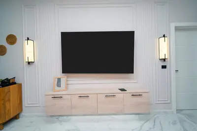 a flat screen tv on a wall in a living room at Cana Rock Star D208 Jaccuzi Pool Golf and Private Beach in Punta Cana