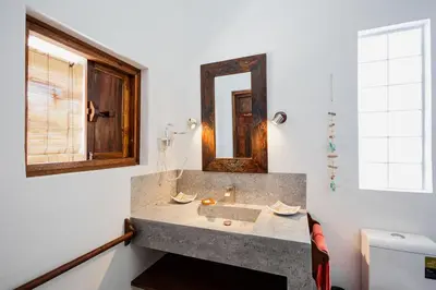 a bathroom with a sink and a mirror at Bali Style Boutique Hotel in Las Terrenas