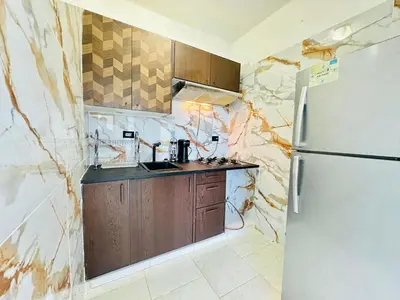 a kitchen with a refrigerator and a sink at Apartartamento cabarete in Cabarete